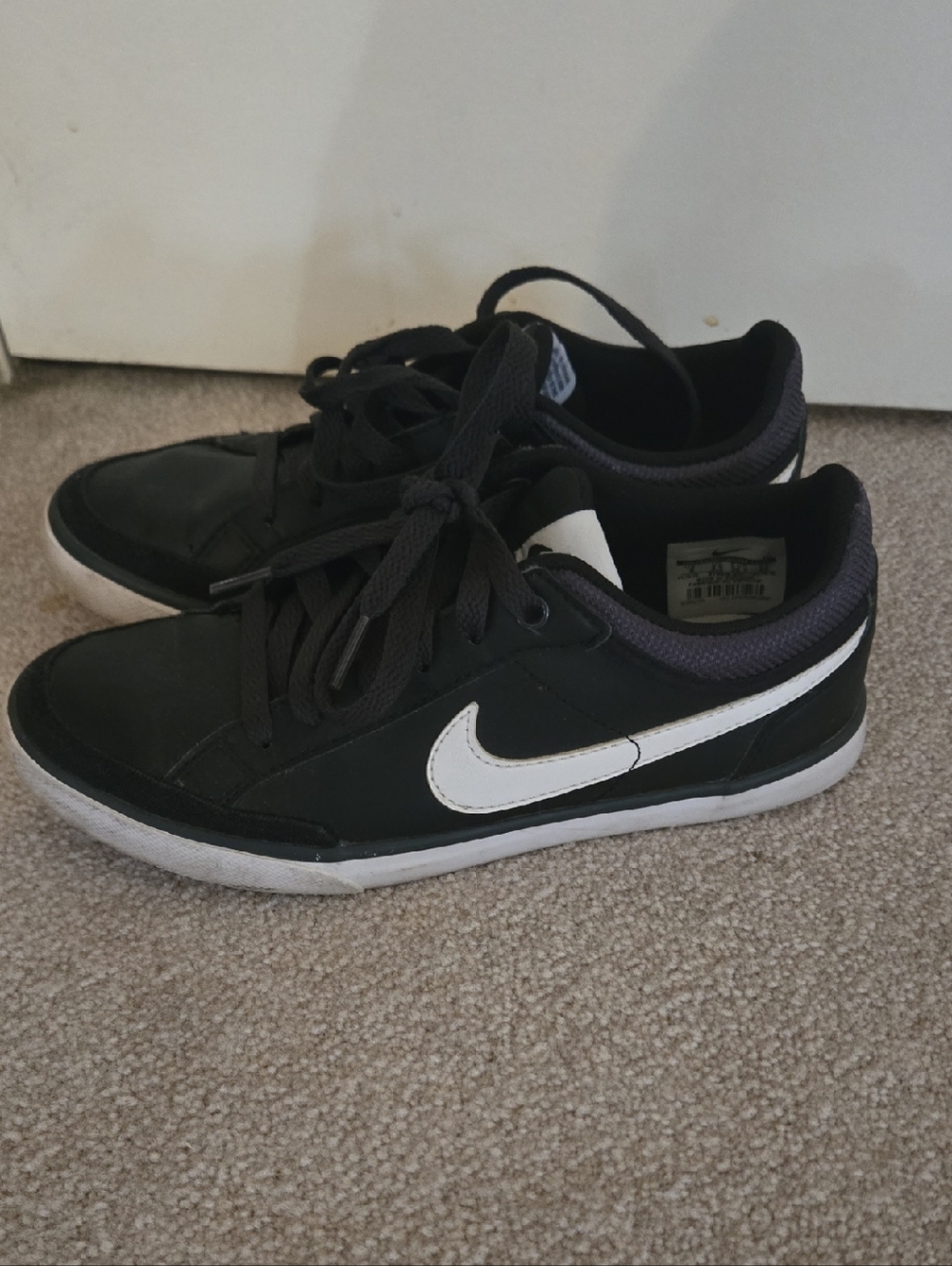 Nike Black Sneakers with White Swoosh Accent